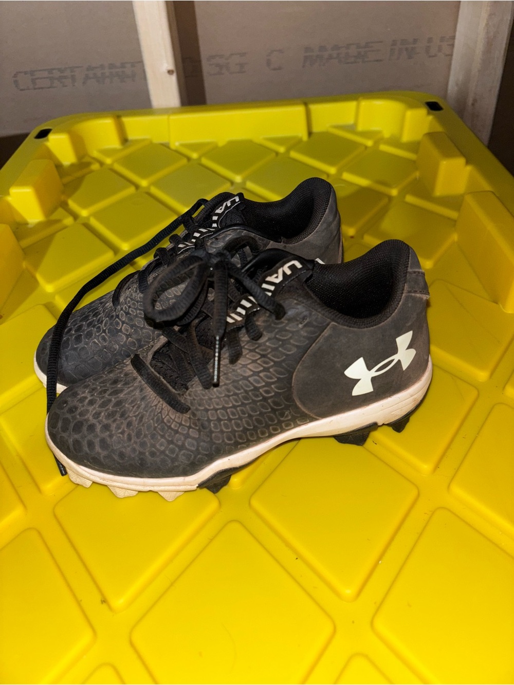 Under Armour Kids Black and White Cleated Athletic Sneakers